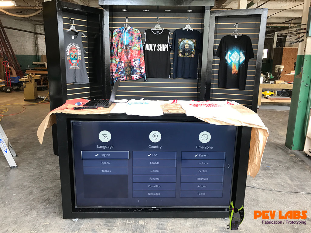 TV Screen in Large Custom Merchandise Cabinetry